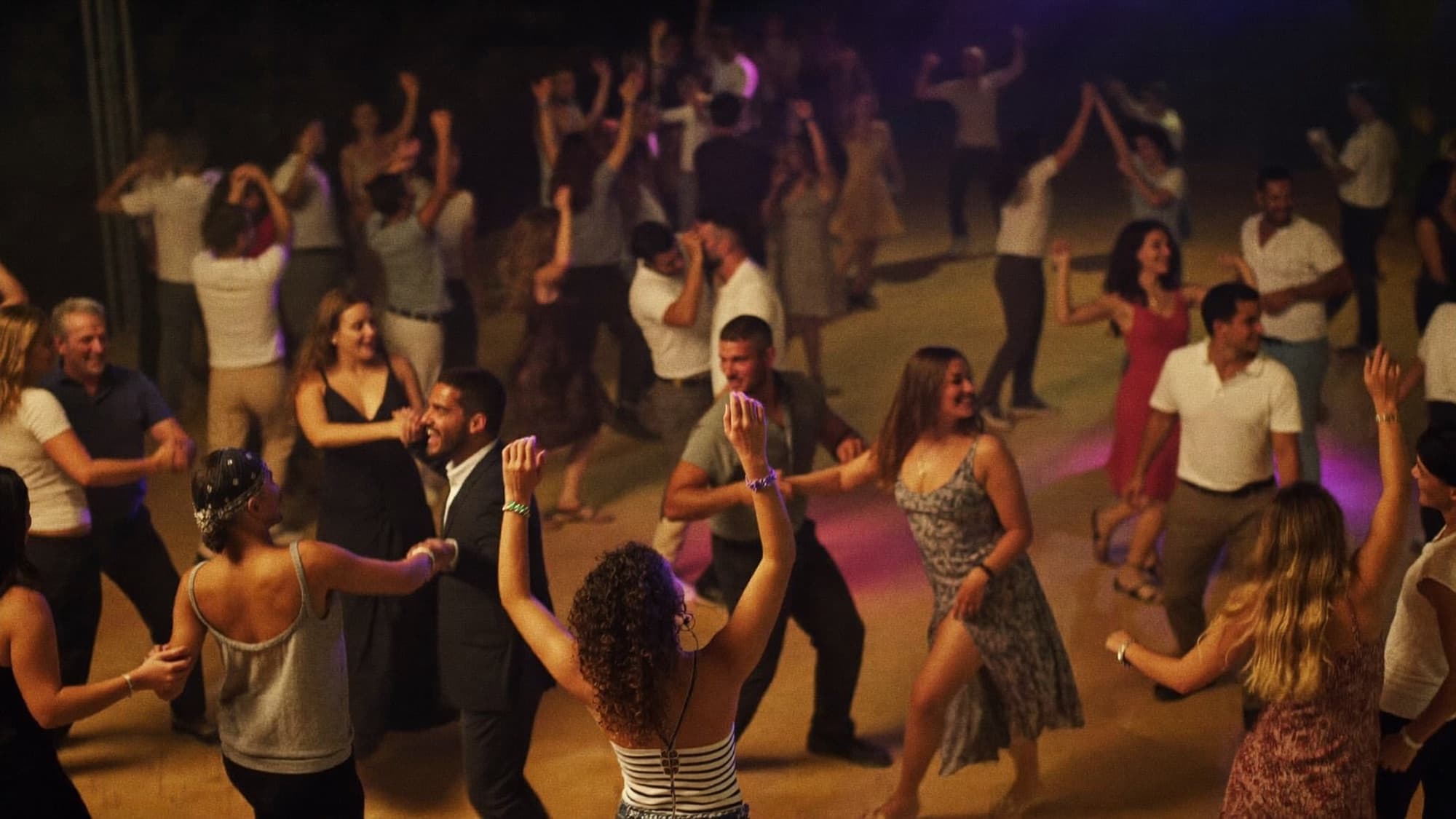 A packed Latin dance social at night