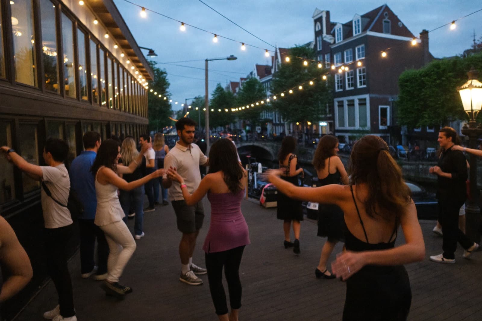 An evening Latin dance social in an Amsterdam canal-house venue